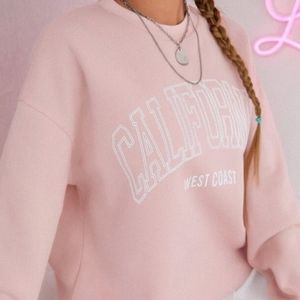 light pink pullover sweatshirt